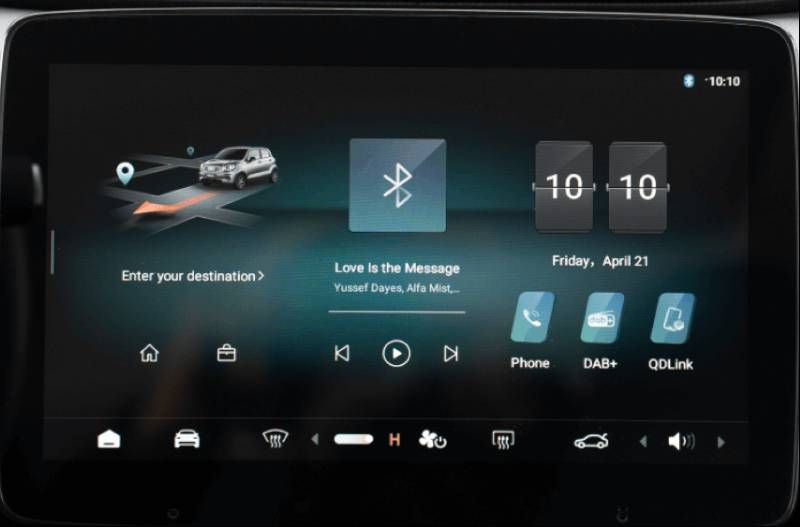 Car infotainment screen showing navigation, media, and app options.