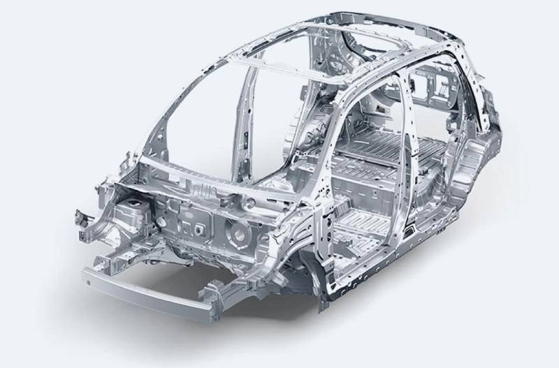 Metal car frame without panels, showing structural components and design.