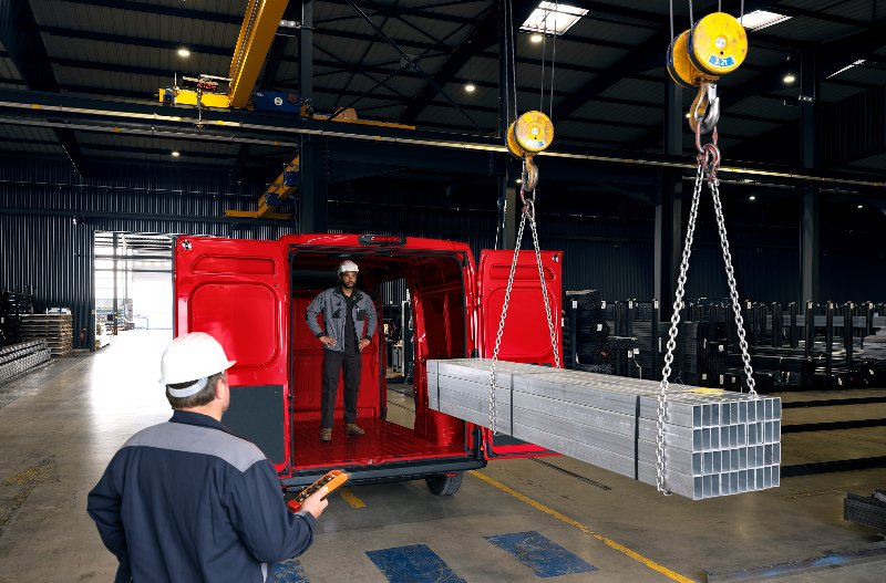 two man loading metal into the van