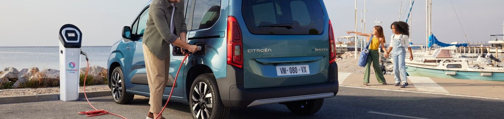 Man plugging in the Berlingo to charge