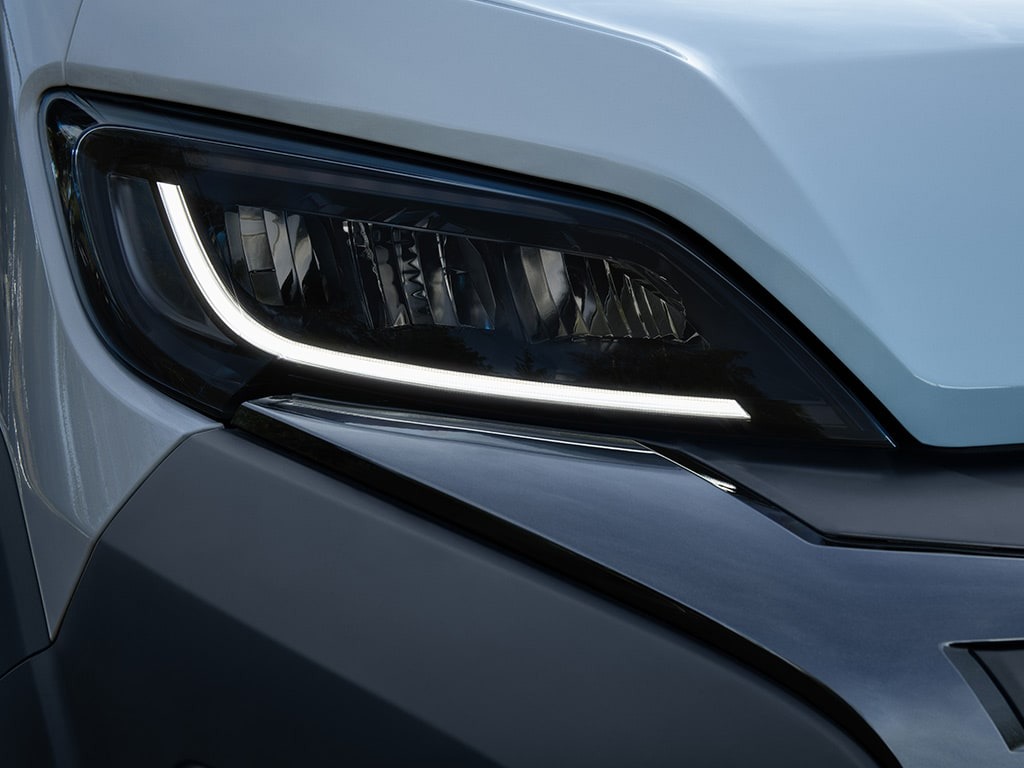 Close-up of a modern car's LED headlight and bodywork.