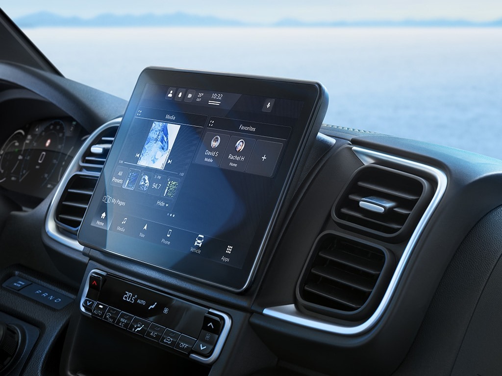 Car interior showing digital display and dashboard controls.