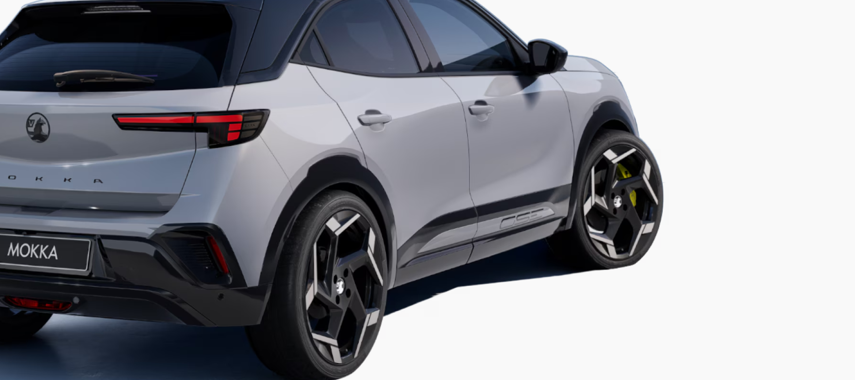 Rear view of a grey Mokka car with distinctive alloy wheels.