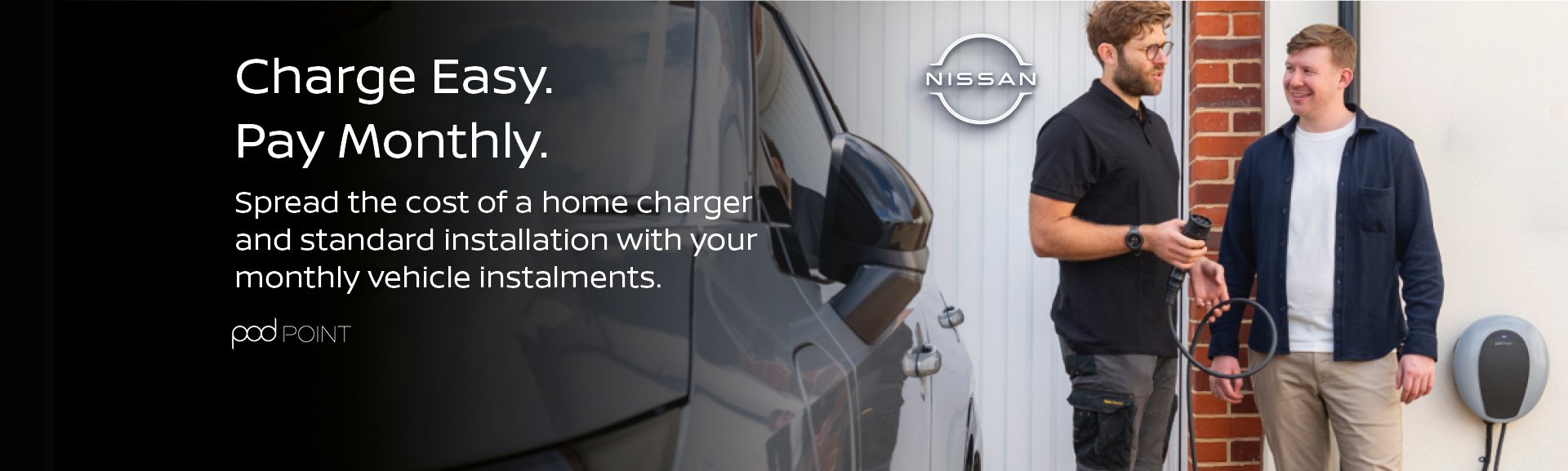 Two people with an electric vehicle charger and promotional text about monthly payments.