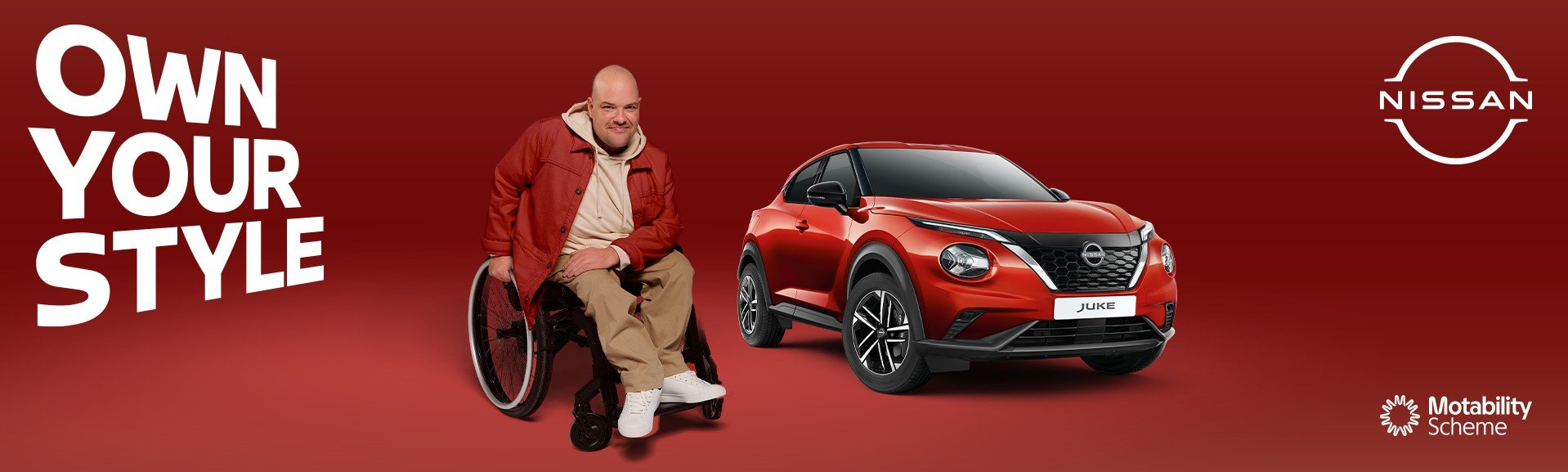 Man in a wheelchair next to a red Nissan Juke with text Own Your Style.