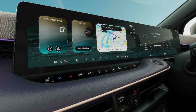 Car dashboard with digital screen displaying navigation and connection options.