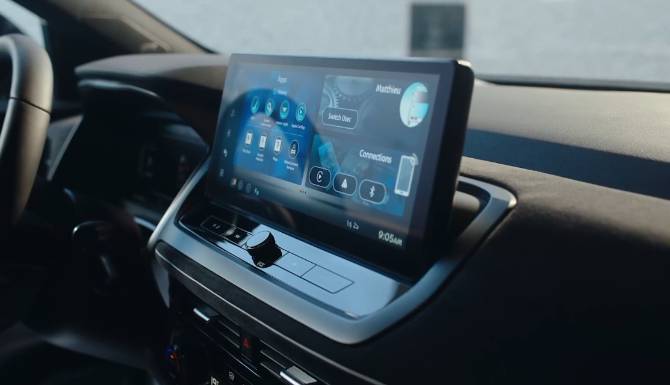 Car infotainment screen displaying various apps and settings.