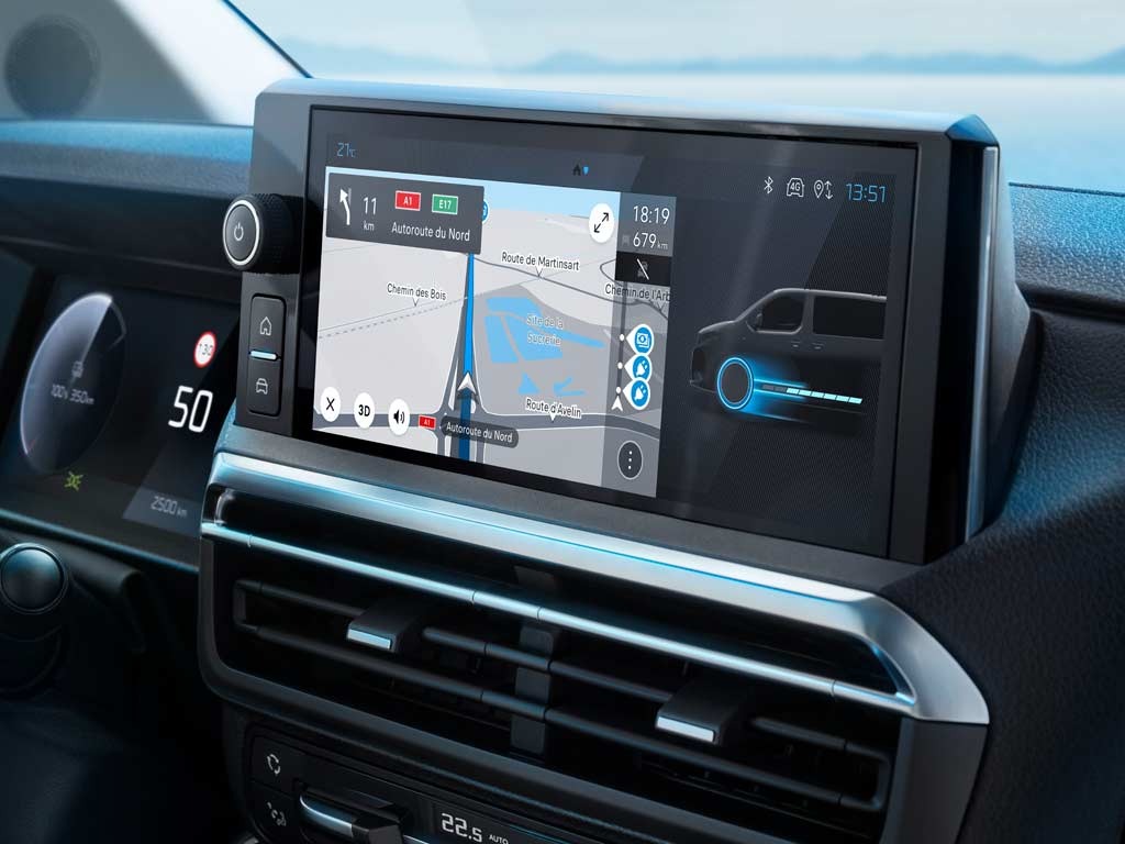 Car infotainment screen displaying navigation and vehicle status.