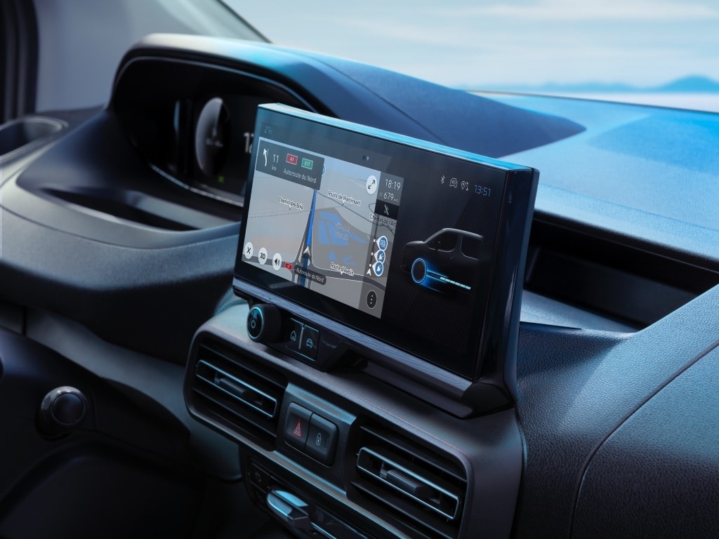 Car dashboard display showing GPS navigation and vehicle information.