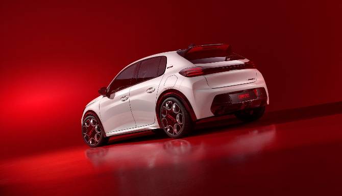 peugeot e208 in white from rear on red background
