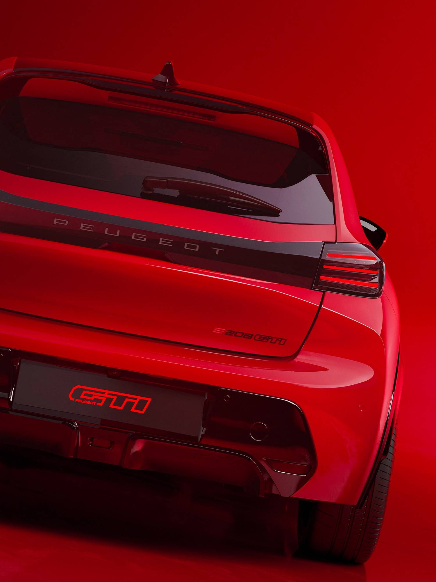 peugeot gti from the rear in red with black detailing