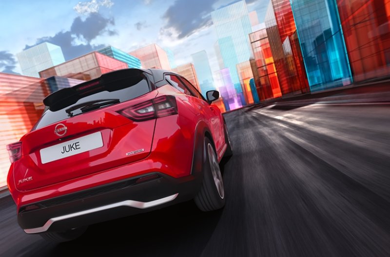 Red car driving on a road with colourful geometric buildings in the background.