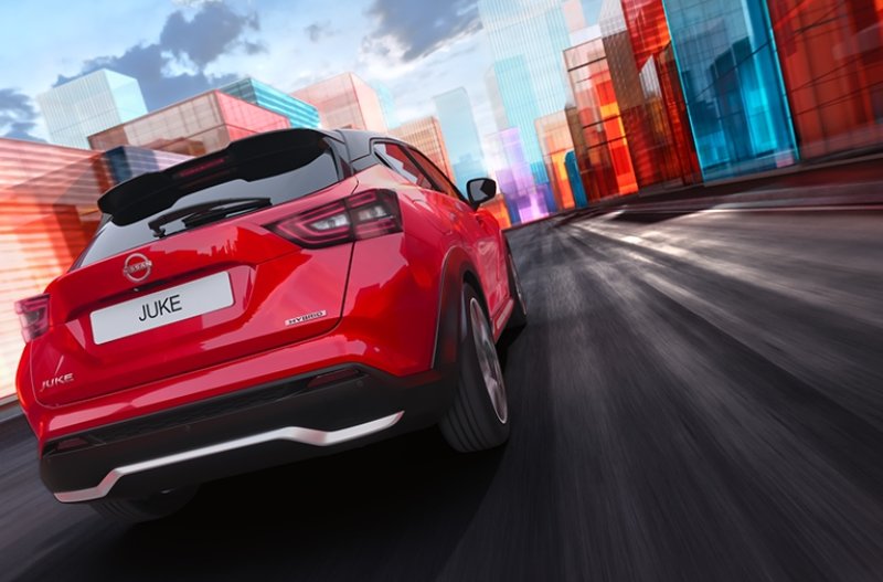 Red car driving through a colourful cityscape.