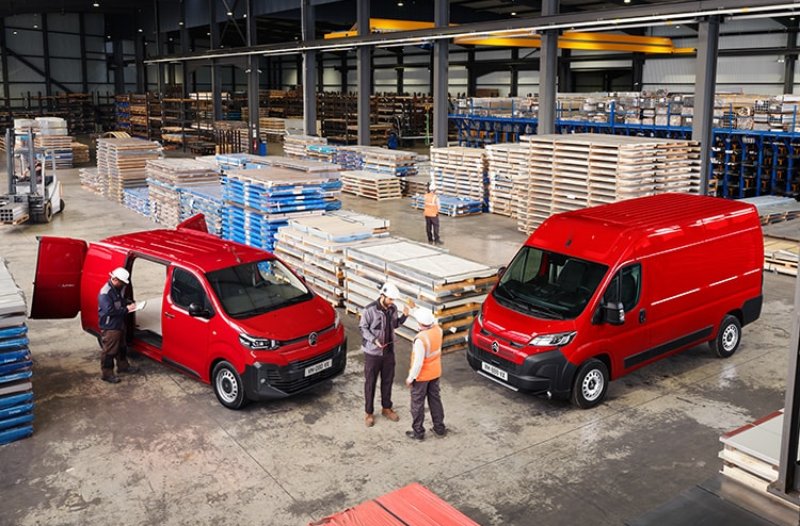 Two vans sat in work site.