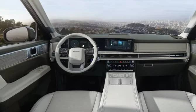 Luxury car interior with a modern steering wheel, digital dashboard, and beige leather seats.