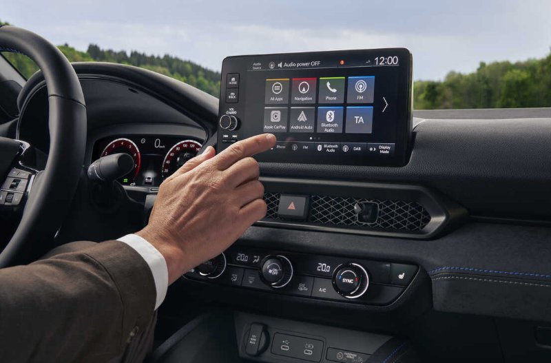 hand touching the screen of car