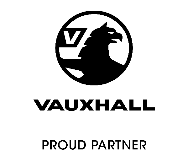 Two gold rings placed side by side on a plain surface.