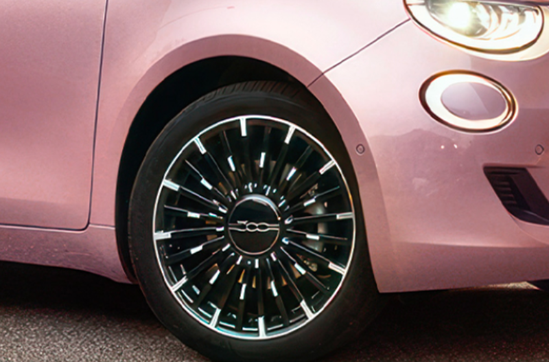 pink car with black alloys