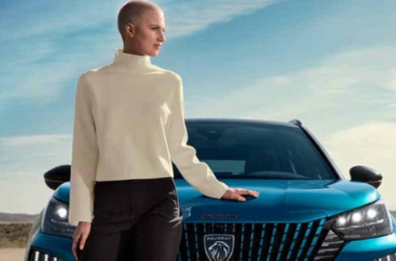 Woman leaning on the 2008 bonnet
