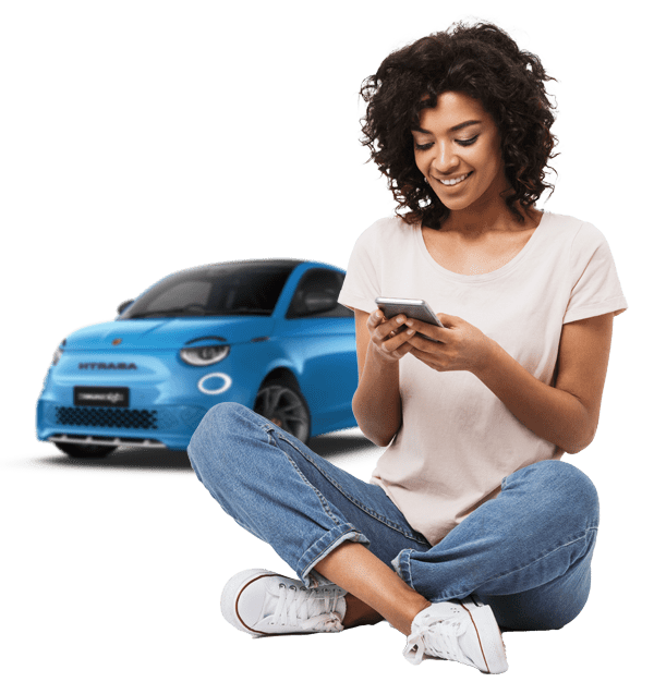 Woman on phone with Abarth 500e behind