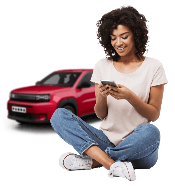Woman on phone with Fiat Grande Panda behind